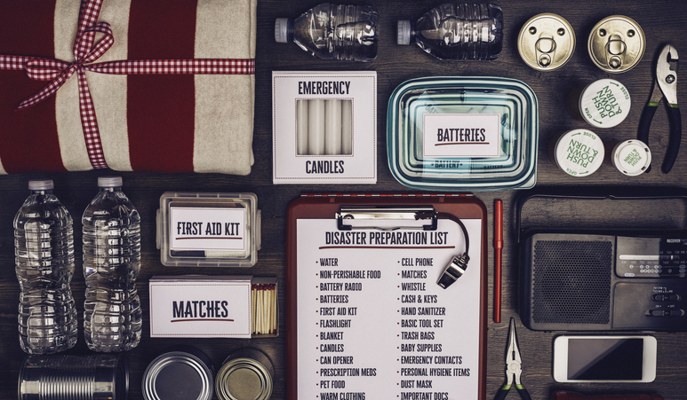 Disaster preparation kit flat lay. Items needed for disaster preparedness Disaster preparation kit flat lay. Items needed for disaster preparedness.