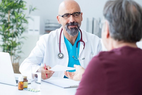 Male doctor talking to patient