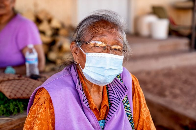 Aged Grandmother Navajo Woman Wearing a Mask to Prevent the Spread of the Corona Virus or Covid-19