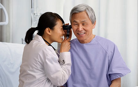 Doctor looking in a patients ear