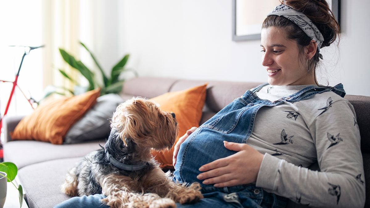 Pregnant woman and puppy