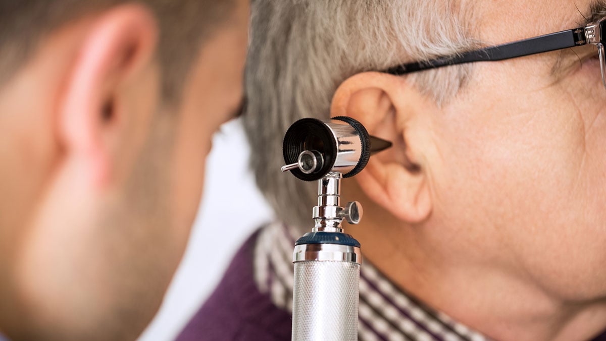 older patient getting a hearing check