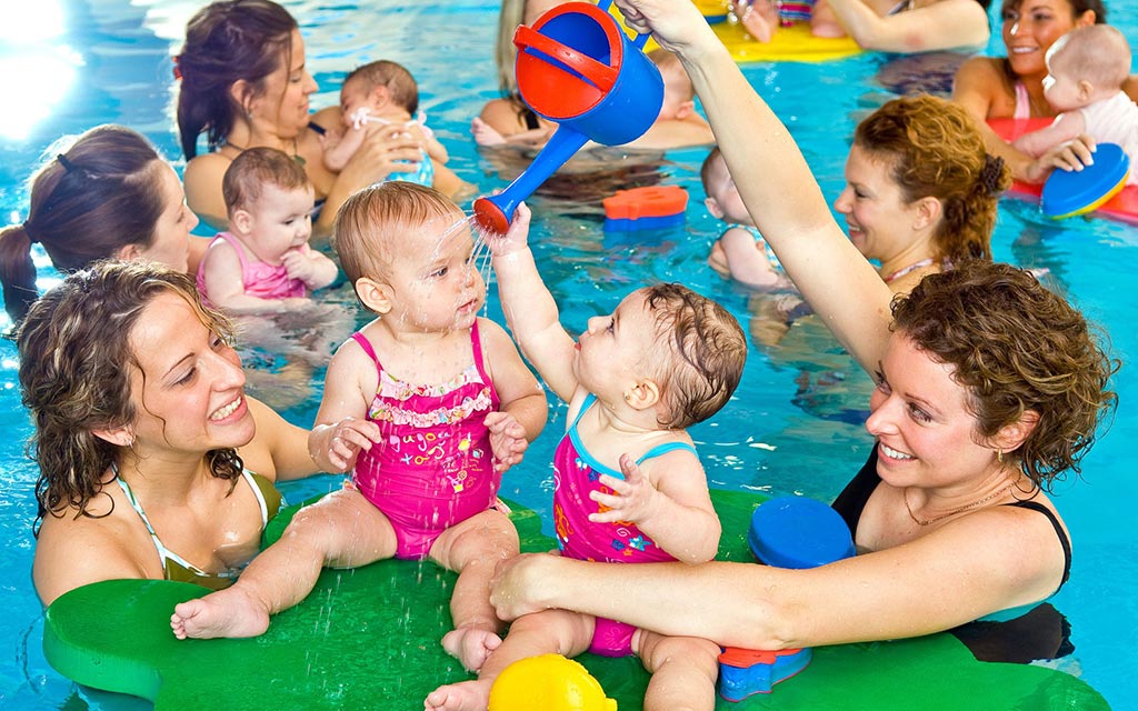 Parents and kids at the infant-parent swim class.