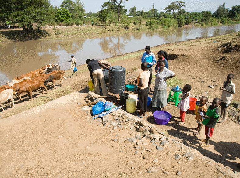 community health workers teach camp members water, sanitation, and hygiene principles