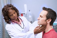 Doctor examining adult male patient