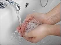 Handwashing under faucet