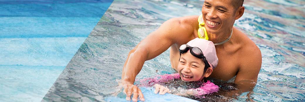 Image of a happy man teaching a child to swim