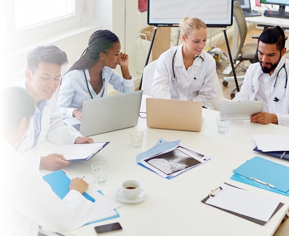 group of healthcare providers meeting at a large table