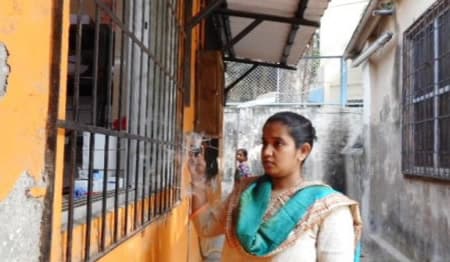 MDRTB in India - An AICU team member using a smoke tube to determine direction of flow of air in a health facility while conducting AIC assessments.