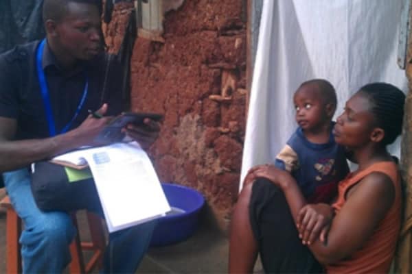 Scientists involved in ARCH work with people in the community and in hospitals to assess colonization with high-threat MDROs through risk factor questionnaires and collection of specimens for colonization testing. Here, a Kenya team member interviews a community participant