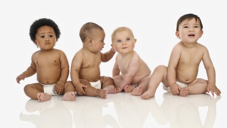 image of four infants in diapers