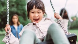 Image of a young girl on a swing