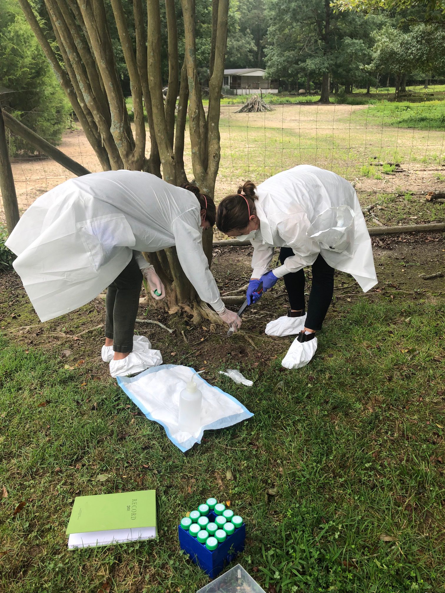 EIS Officer Julia Petras (right) and microbiologist Mindy Elrod (left) collect soil samples during an Epi-Aid in Georgia as part of the multi-state melioidosis outbreak investigation in August 2021.