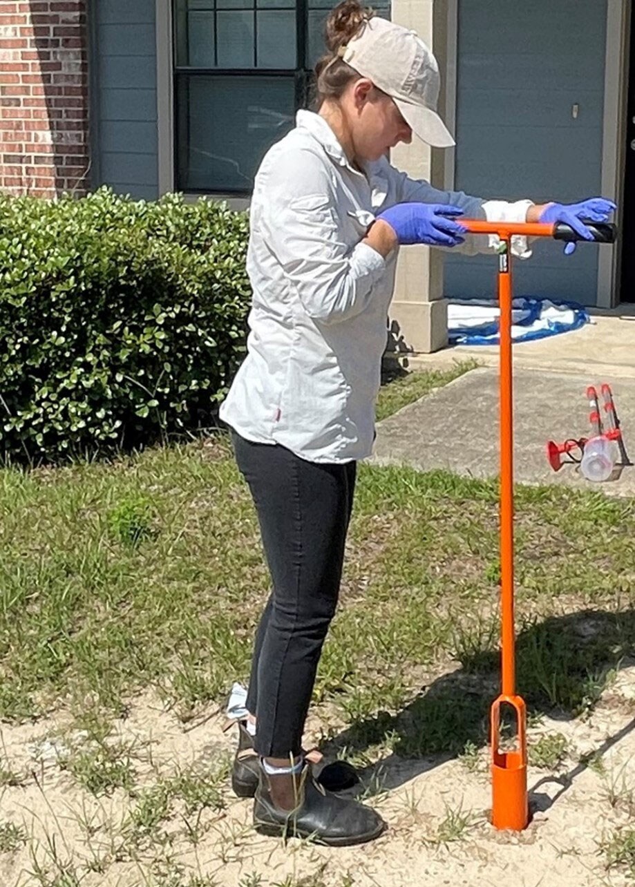 EIS officer Julia Petras collects soil samples