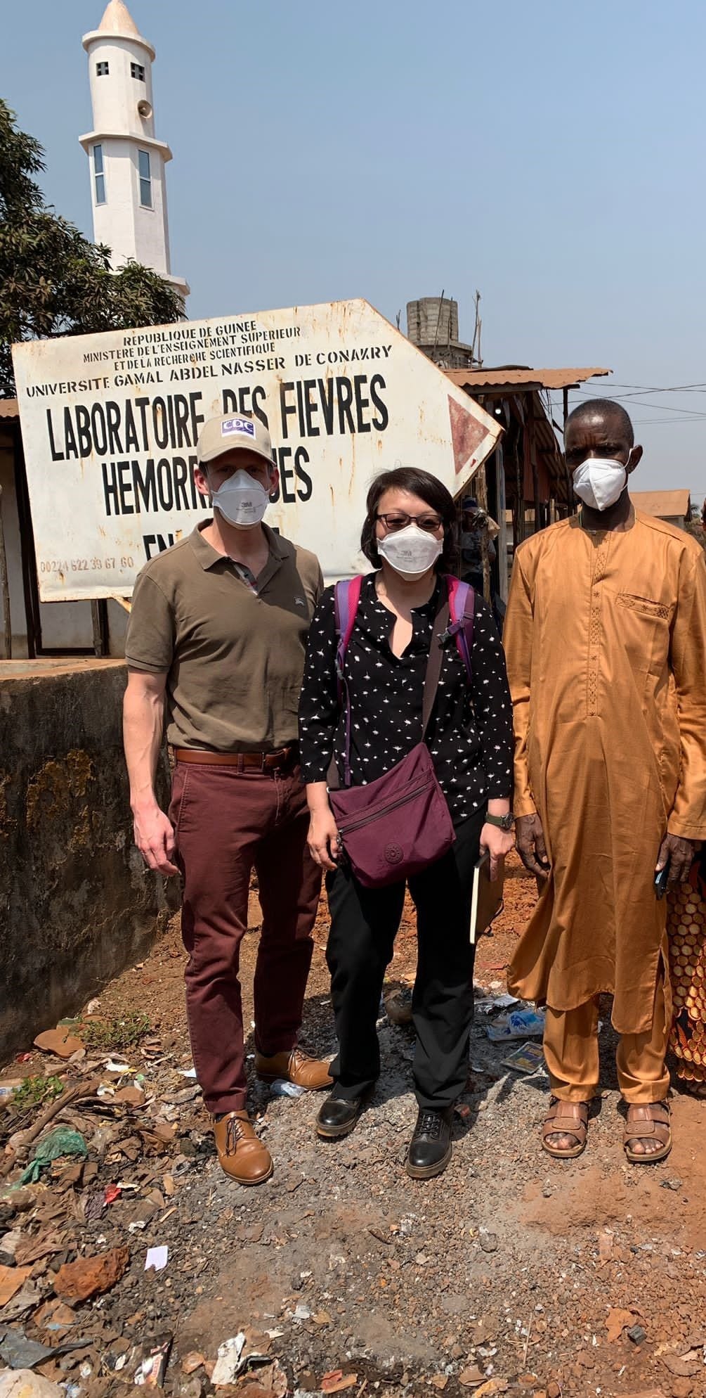 EIS Officer Jason Malenfant (left) and supervisor Mary Choi (center) meet with the Director of the Viral Hemorrhagic Fever Laboratory, N’Faly Magassouba (right), in Conakry, Guinea in February of 2022 to plan post-outbreak surveillance activities following West Africa’s first outbreak of Marburg virus disease.