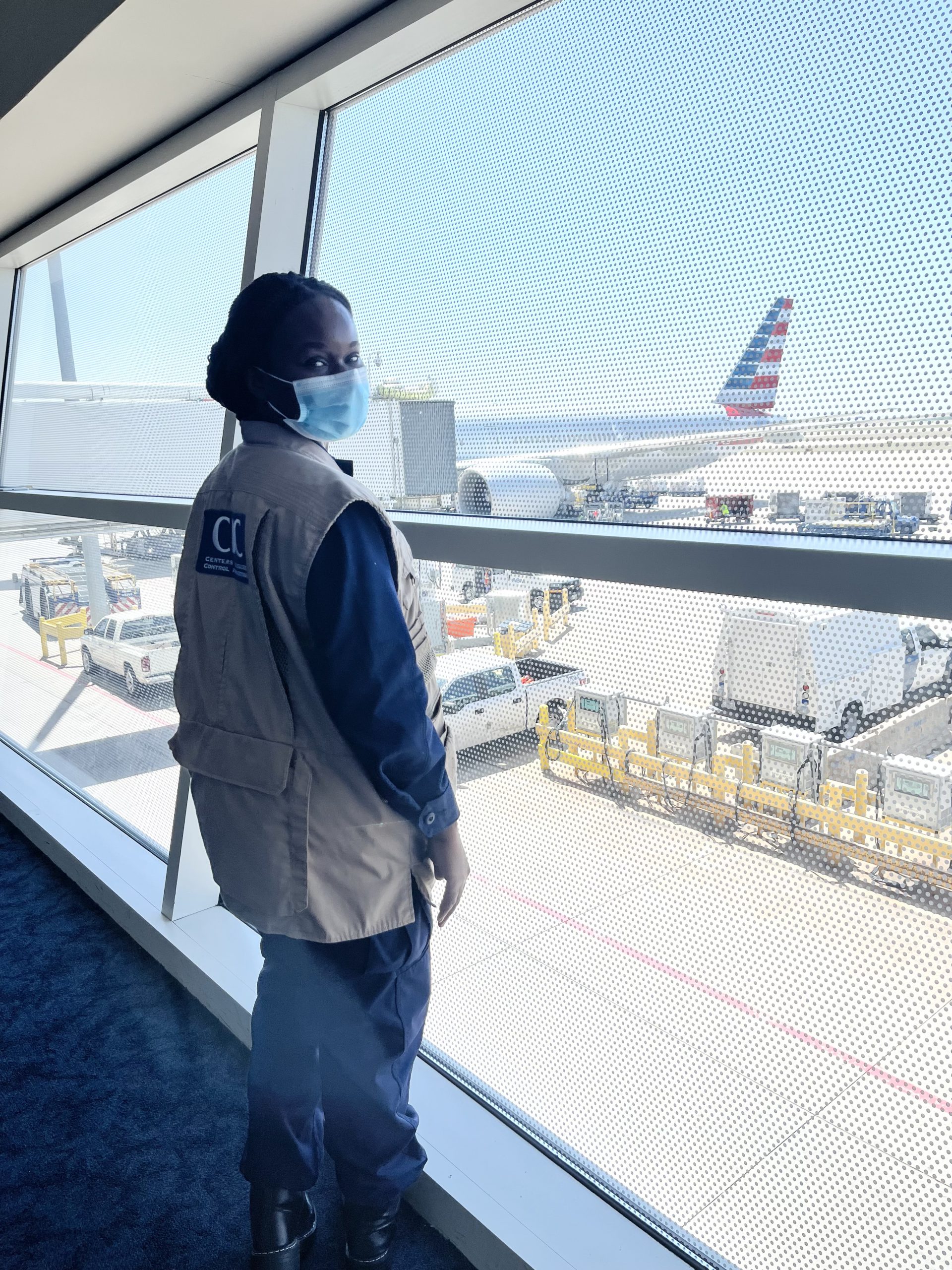 EIS officer AdeSubomi Adeyemo waits to perform Global Vaccine and Global Testing Order compliance checks for international flights at the Dallas Fort Worth Quarantine Station in March 2022.