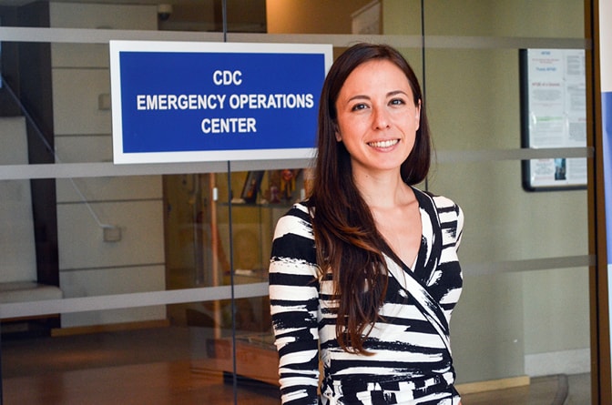 Rachel Burke, PhD, MPH, EIS Class of 2016, in front of CDC’s Emergency Operations 