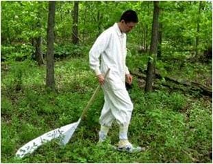 EIS officer wears protective clothing while dragging for ticks at Gettysburg Military Park in Pennsylvania during a Lyme disease investigation.