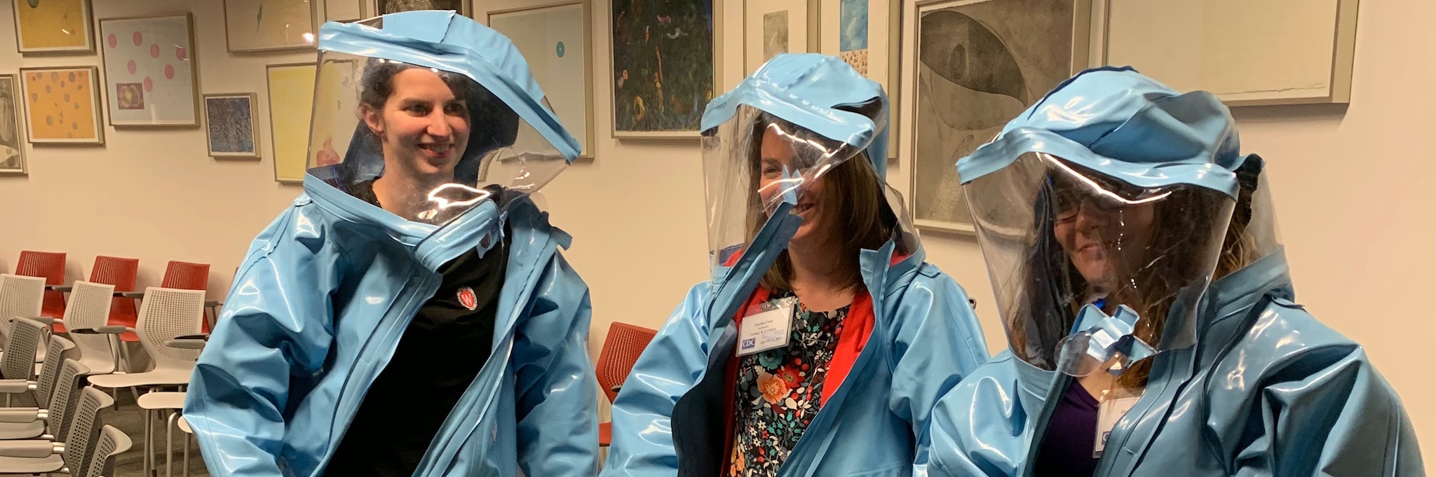 EEP Students try on biosafety suits during a tour of the CDC Museum