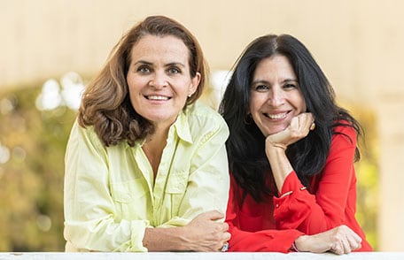 Three mature women smiling