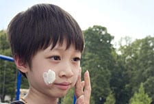 Boy with sunscreen on face