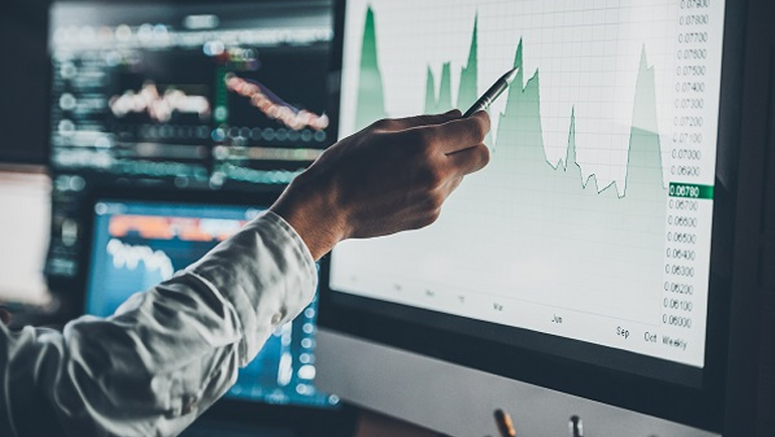 A person analyzing data on a computer screen.
