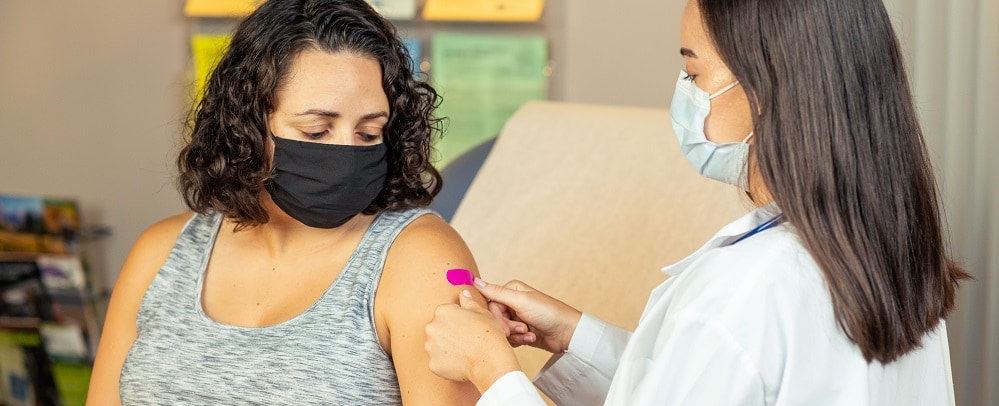 Woman receiving flu vaccine