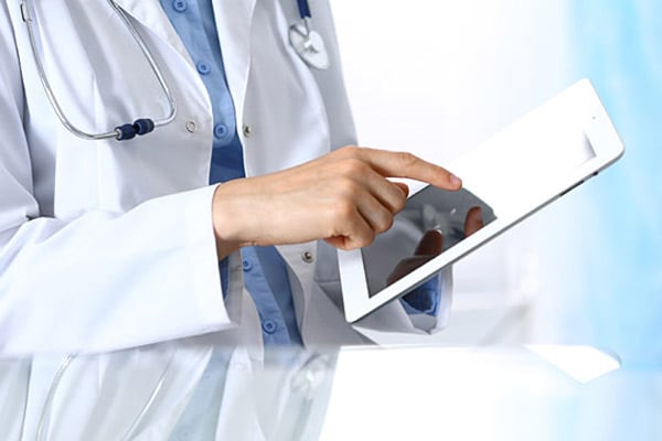 healthcare professional using tablet