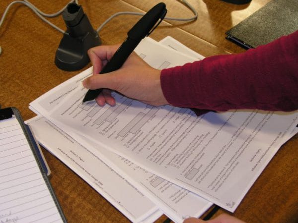person filling out paperwork