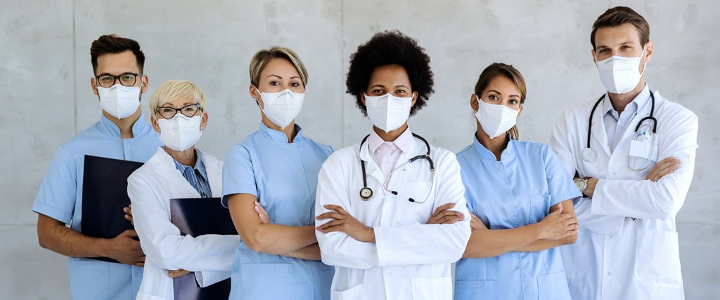 team of confident medical experts with protective face masks