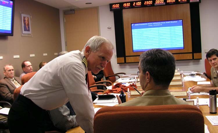 Members of the 2009 H1N1 Pandemic response leadership team meet in the executive conference room 