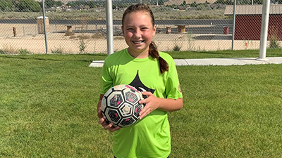 Photo of Harlee on a soccer field