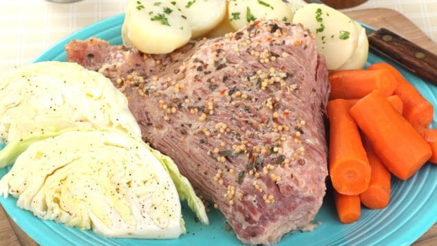 PHoto of corned beef and potatoes on a plate.