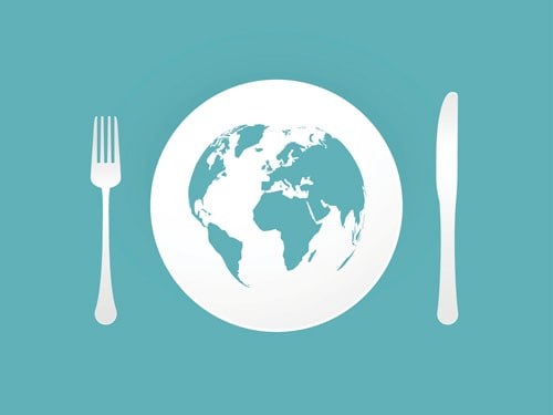 A globe with a knife and fork on either side
