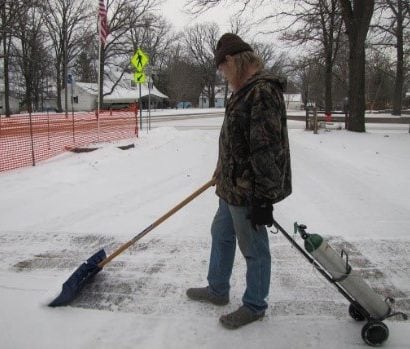 Ken shoveling snow