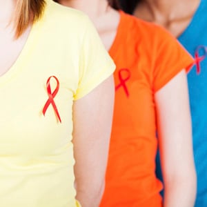  Women with HIV ribbon on shirt