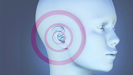 sideview of a person's head with a target on the ear