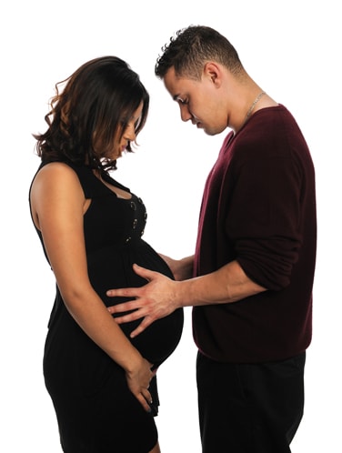 young man touching the pregnant women's belly