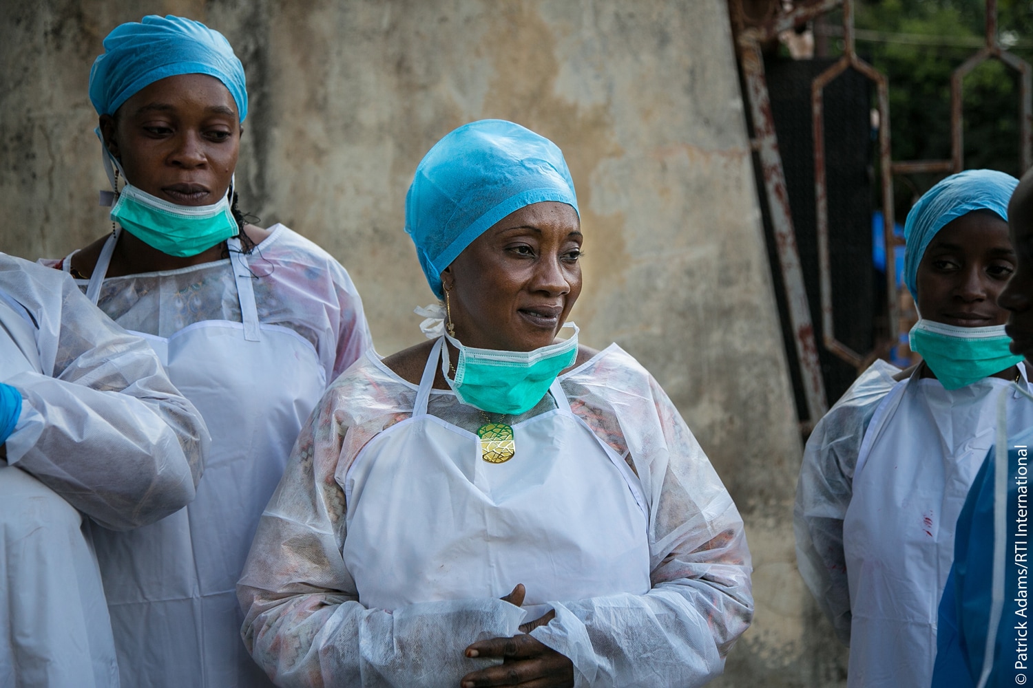 Group of women in personal protective equipment.