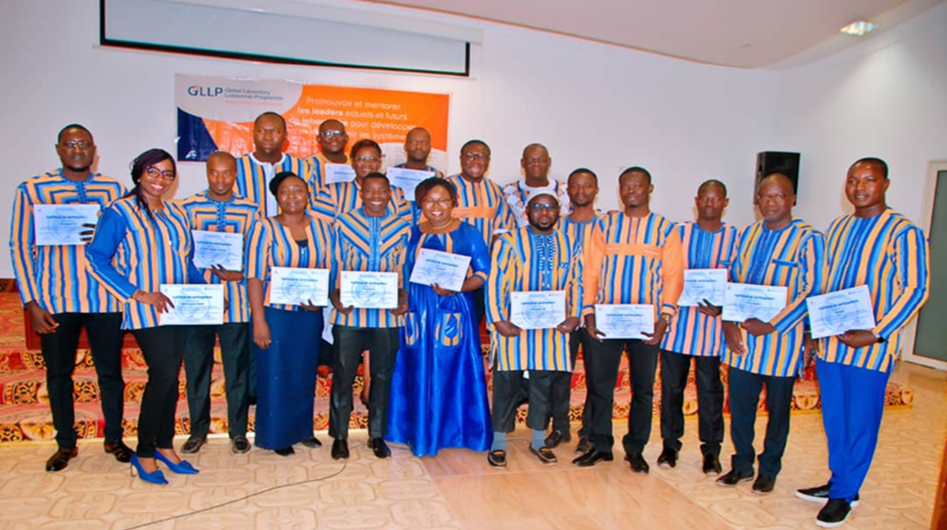 Group of Global Laboratory Leadership Program graduates holding certificates.