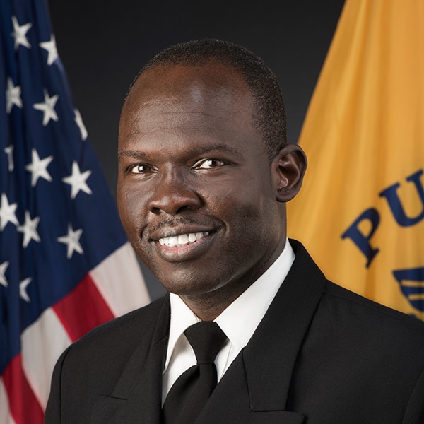 Image of Black man wearing a US Public Health Service uniform. Black jacket, black tie, and white shirt. CAPT Simon Agolory, MD. Division of Global Health Protection, Acting Director