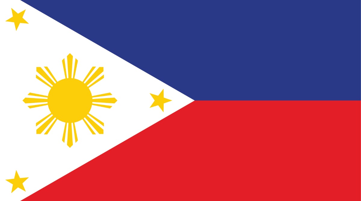 Flag of the Philippines. Two equal horizontal bands of blue (top) and red. A white equilateral triangle is based on the left (hoist) side. The center of the triangle displays a yellow sun with eight primary rays. Each corner of the triangle contains a small, yellow, five-pointed star.