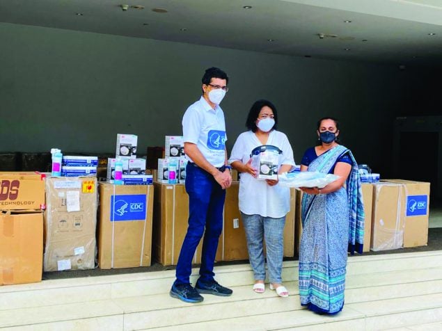 CDC team distributes critical COVID-19 supplies to a Mizoram state official, 2021. Photo credit: CDC India office
