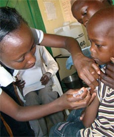 Child receiving vaccine in a clinic