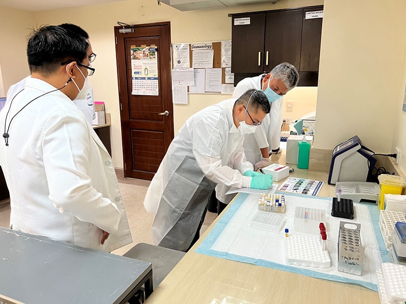 Mervi Detorio of the CDC International Laboratory Branch demonstrates the Asante HIV-1 Rapid Recency Assay