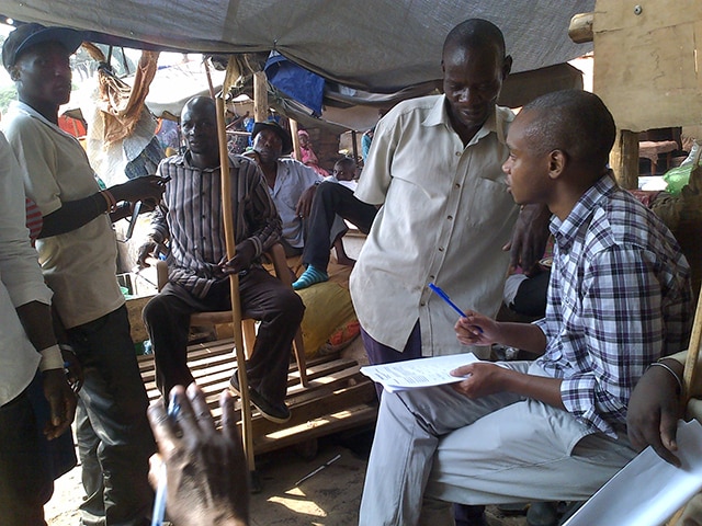 Benon wesiga, MD, conducting a community investigation.