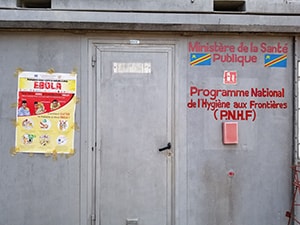 French poster showing Ebola symptoms and ways to avoid catching the virus outside of a Ministry of Health building in the Democratic Republic of the Congo. Photo: Dante Bugli, ERRB