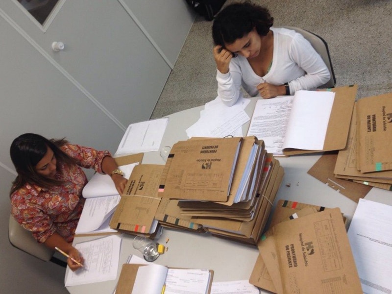 FETP residents reviewing medical records during investigation of Guillain-Barre Syndrome during Zika epidemic in Salvador, Bahia, Brazil (2017).