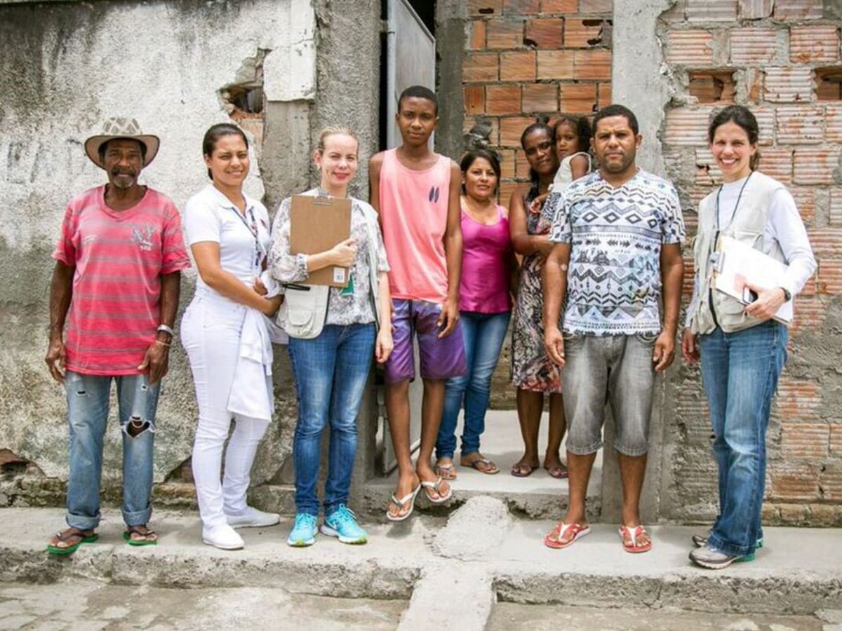 Tatiana M. Lanzieri (far right) and FETP resident Juliane Malta (third from left) conducting field work and investigation of Guillain-Barre Syndrome during Zika epidemic in Salvador, Bahia, Brazil (2017).
