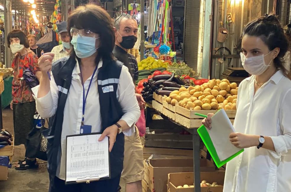 Dr. Lia Sanodze (front left) and her FELTP team conduct a COVID-19 survey at a marketplace.
